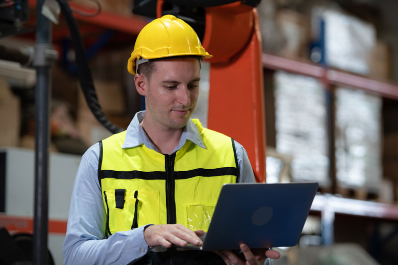 Male engineer checking how the operation can reduce manufacturing costs