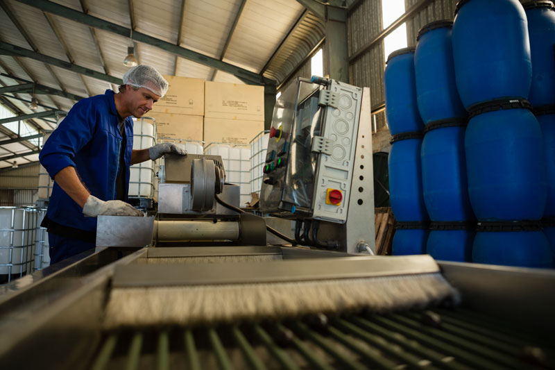 Worker figuring out how to reduce changeover times for machine